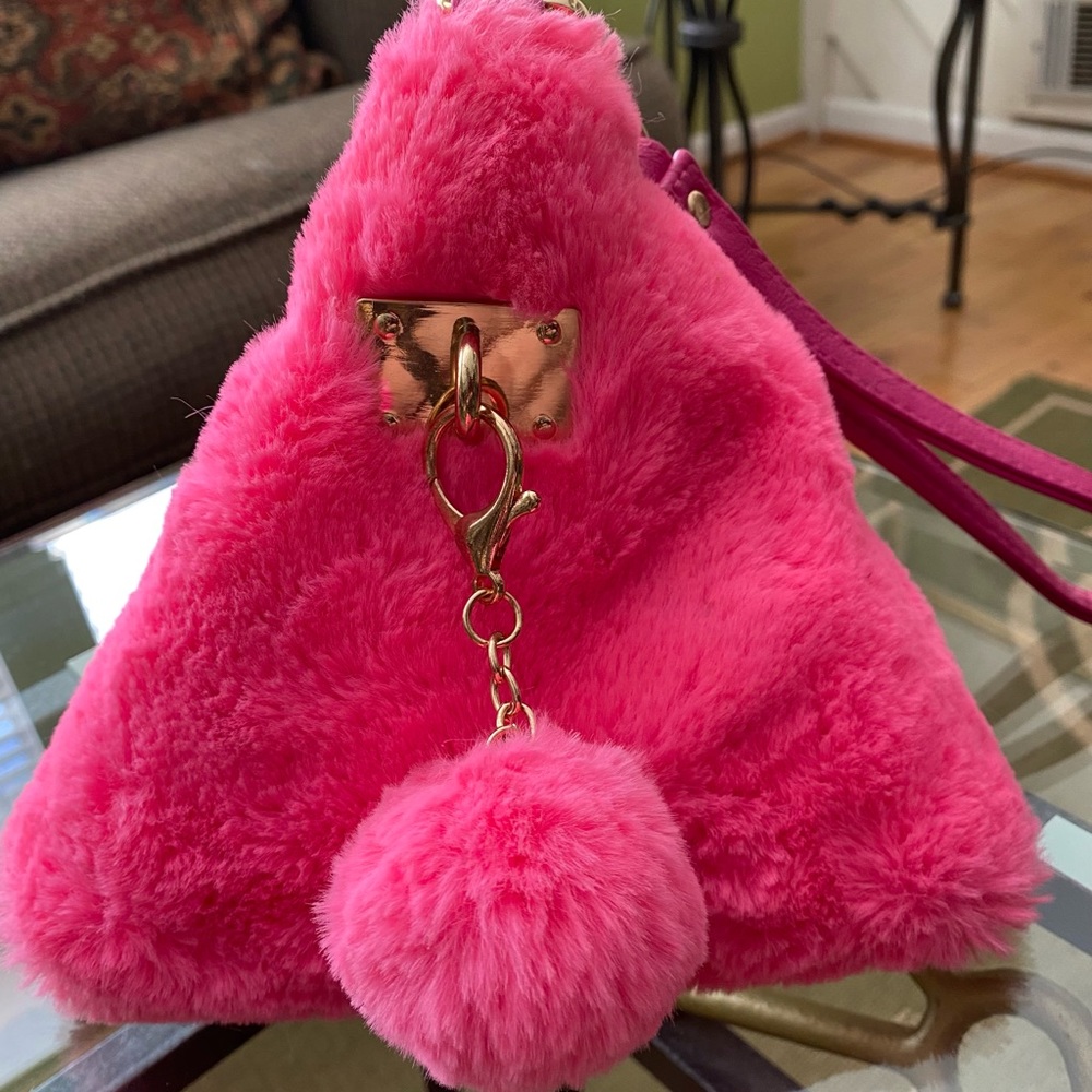 Soft and fuzzy pink triangle wristlet purse!